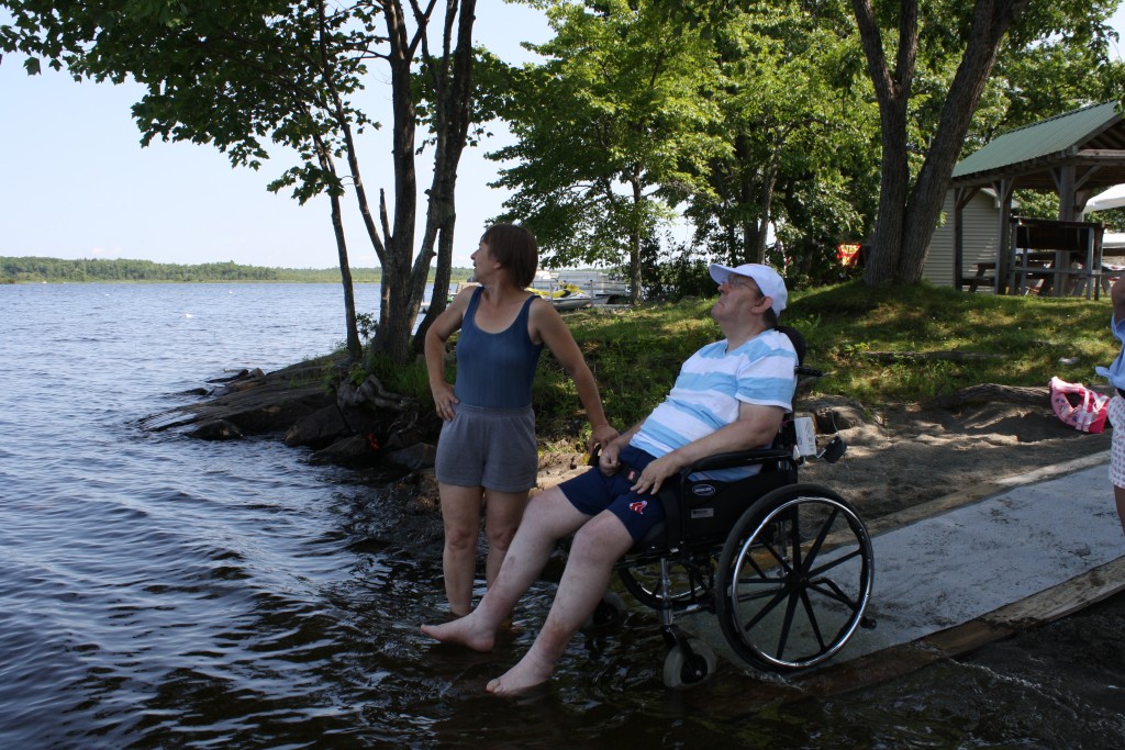 Independence Advocates of Maine client being supported by lake